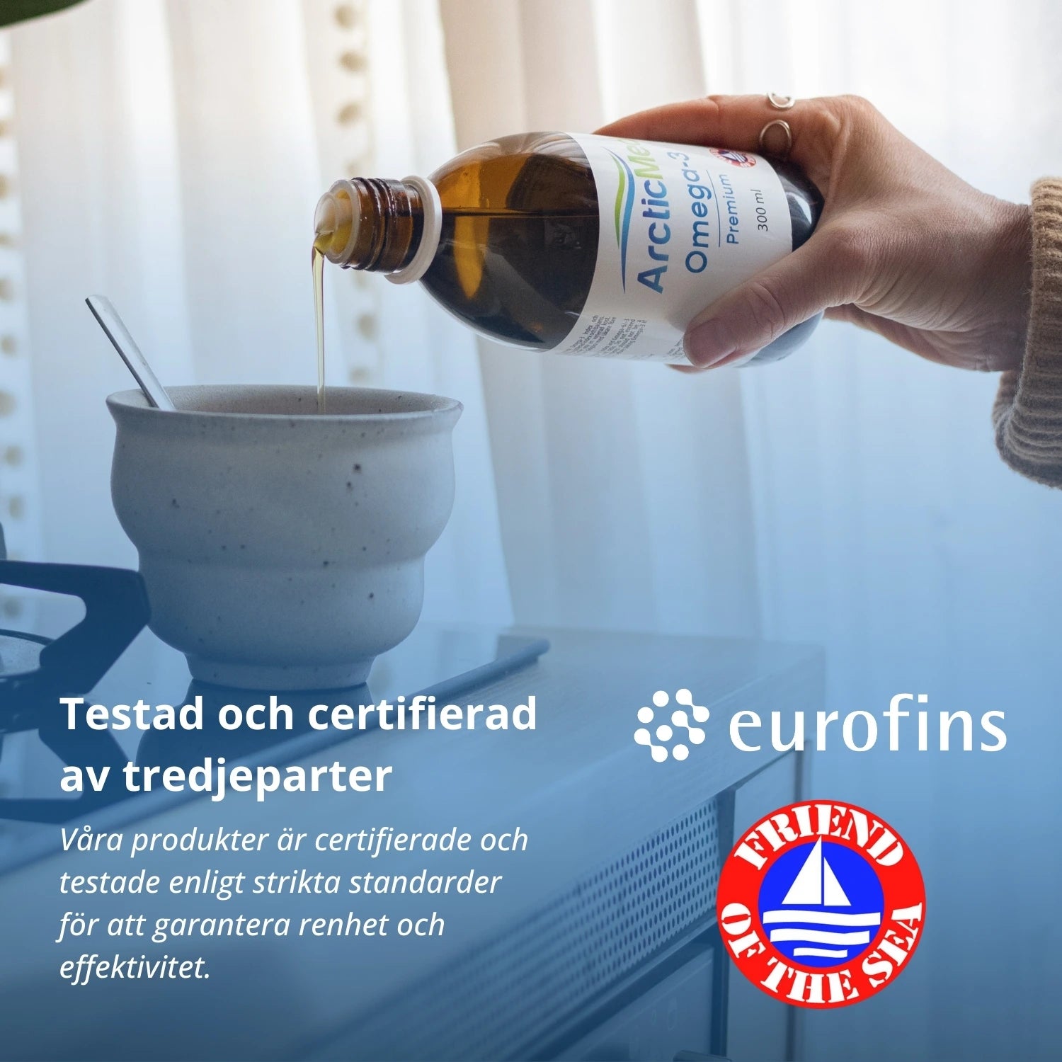 Liquid poured from an amber glass ArcticMed Omega-3 Premium 300 ml bottle into a ceramic cup.